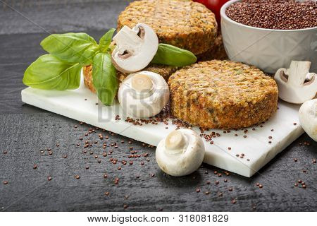 Tasty Vegetarian And Vegan Burgers Made From Healthy Quinoa, Basil, Tomatoes And Champignon Mushroom