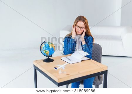 Young Female Office Worker Has Headache After Hard Working Day. Fatigue And Overworked Girl Keeps Ha