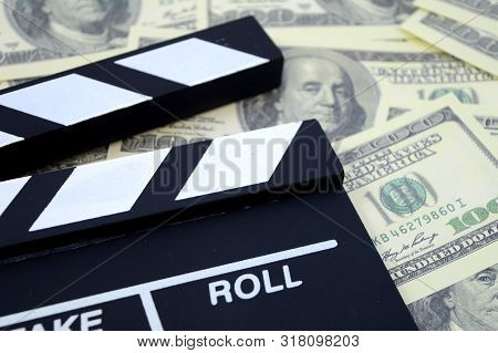 A Conceptual Image Focused On The Movie Industry And The Money It Can Produce Using A Clapboard And 