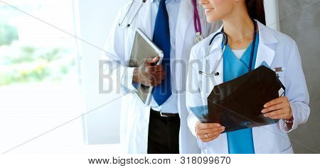 Doctors Analyzing An X-ray In A Meting. Doctors