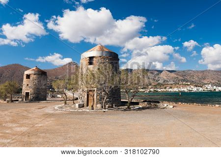 Old Windmills Poros Elounda at Spinalonga Peninsula near the town of Elounda, Island of Crete - Greece