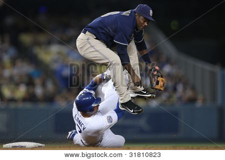 LOS ANGELES - SEP 23: San Diego Padres SS #10 Miguel Tejada & Dodgers 1B #7 James Loney during the Padres vs. Dodgers game on Sept 23 2010 at Dodgers Stadium.