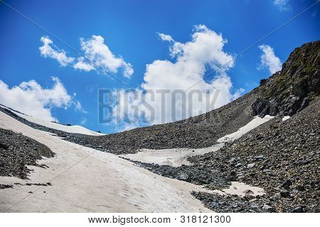 Beautiful View Of The Snow Mountain, And Cloudy Sky. Scenic Alpine Landscape Mountain Ranges. Terske