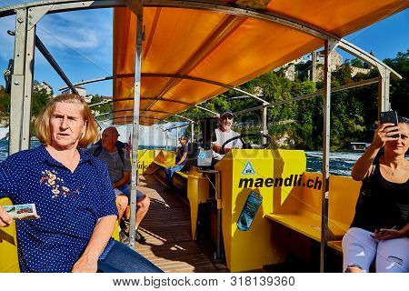 Rhine, Switzerland - September 19, 2018: Tourists Sitting In The Boat On The River Rhine Near The Rh