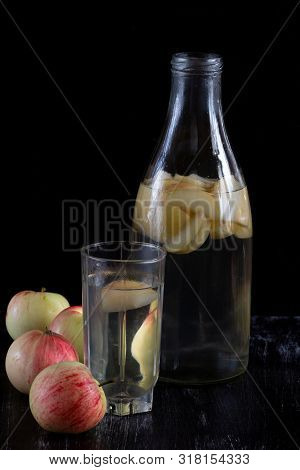 Apple Kompot In Glass Bottle On Black The Background