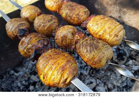 Potato Skewers With Crispy Crust Is Fried On Grill. Healthy Eating Concept