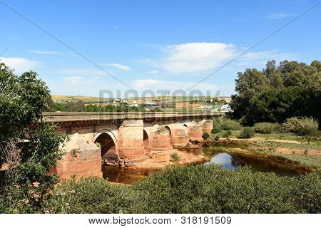 Roman Bridge And Rio Tinto In Niebla Village, Huelva Province, Andalusia, Spain
