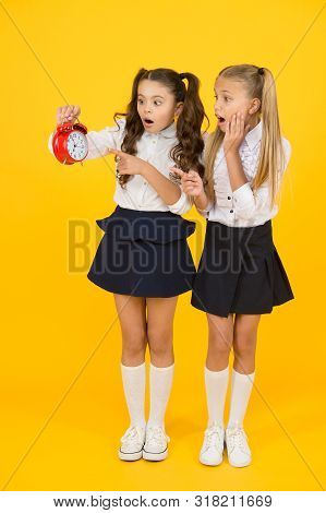 Latecomer Will Be Punished. It Is Time. School Schedule. School Time. Schoolgirls And Alarm Clock. C