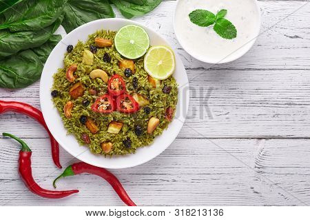 Palak Paneer Biryani At White Wooden Background. Palak Paneer Biryani Is Vegetarian Indian Cuisine D