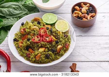 Palak Paneer Biryani At White Wooden Background. Palak Paneer Biryani Is Vegetarian Indian Cuisine D