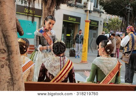 Valencia, Spain- March 12, 2018: Women Falleras Majors Of Valencia Chatting, Dressed In The Typical 