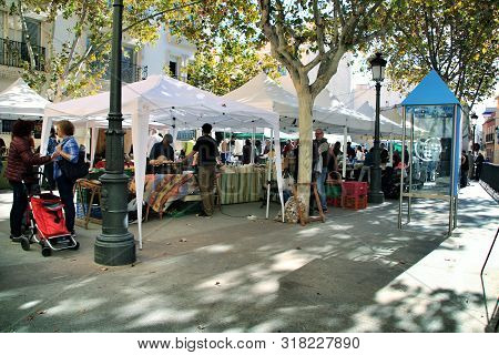 Elche, Alicante, Spain- December 1, 2018: People Buying In The Local Ecological Market In The Main S