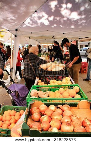 Elche, Alicante, Spain- December 1, 2018: People Buying In The Local Ecological Market In The Main S
