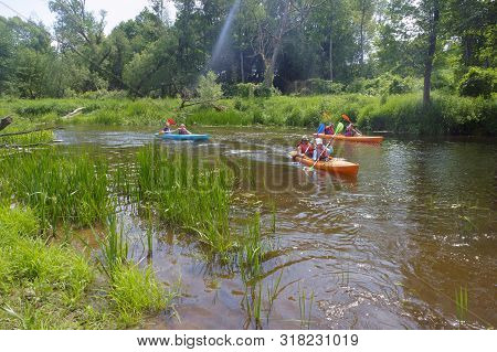 Kayaking On The River, Three Kayaks Go On The River, Angrapa River, Kaliningrad Region, Russia, East