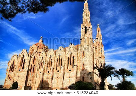 Novelda, Alicante, Spain- November 28, 2018: Details, Archs, Tower And Tiles Of Sanctuary Of Santa M