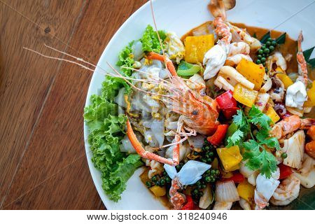 Seafood Thai Mixxed Together Between Boiled Shrimp, Crab, Squid And Colourful Vegetable In Dish On W
