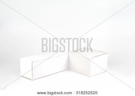 White Two Paper Boxes - Tall And Fat Lay On The White Background In Studio Shot With Clipping Paht.