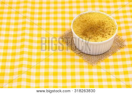 Brazilian Sweet Corn, Corn Mousse On A Wooden Background With Copy Space. Typical Brazilian Dessert,