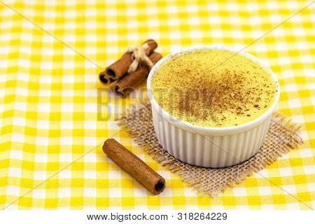 Brazilian Sweet Corn, Corn Mousse On A Wooden Background With Copy Space. Typical Brazilian Dessert,