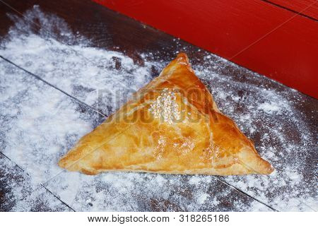 Samsa On A Table Covered With Flour. Samsa - Uzbek National Cuisine