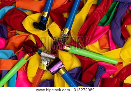 Birthday Party Whistles And Colorful Deflated Balloons