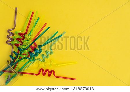 Mixed Colors Of Spiral Straws On Yellow Background