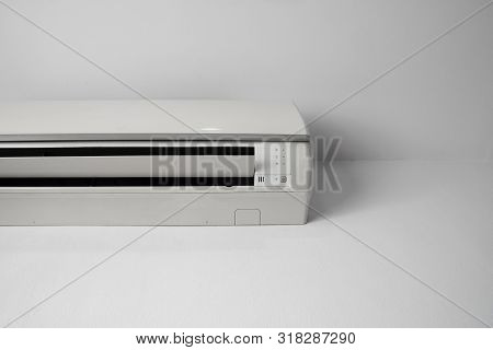 Air Conditioner Mounted On A White Wall In The Living Room Or Bedroom. Indooor Comfort Temperature. 