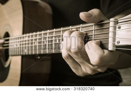 Guitar Player Hand Or Musician Hand In C Major Chord On Acoustic Guitar String With Soft Natural Lig