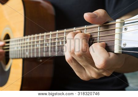 Guitar Player Hand Or Musician Hand In C Major Chord On Acoustic Guitar String With Soft Natural Lig