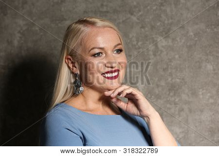 Portrait Of Beautiful Mature Woman On Grey Background, Space For Text