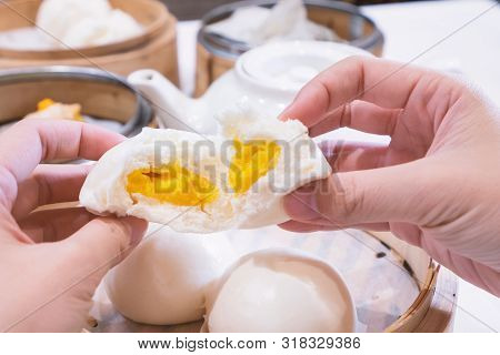Delicious Dim Sum, Famous Cantonese Food In Asia, Fresh And Hot Salted Creamy Custard Buns In Bamboo