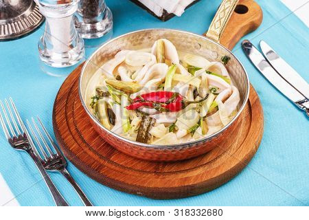 Mediterranean Noodle Soup With Colmar Rings, Onions, Cucumbers And Hot Peppers
