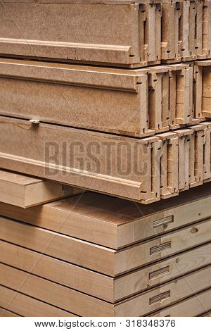 Joinery. Wood Door Manufacturing Process. Stacked Door Leafs And Architraves. Furniture Manufacture.