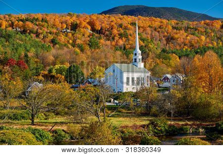 Iconic New England church in Stowe town at autumn in Vermont, USA 