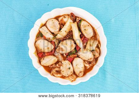 Mediterranean Dish, Stewed In Broth Colmar In Tomato With Pepper