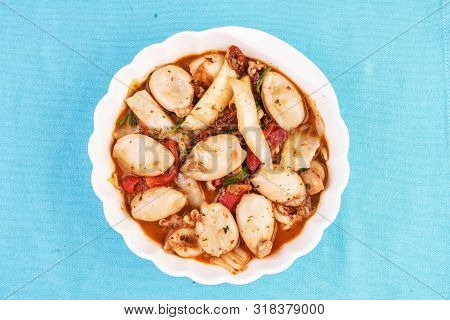Mediterranean dish, stewed in broth Colmar in tomato with pepper