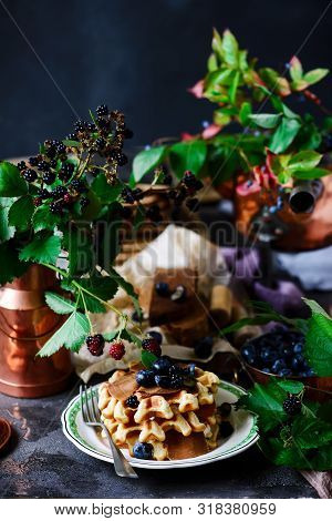 Norwegian Waffles With Brunost Cheese And Blueberries.style Rustic.selective Focus