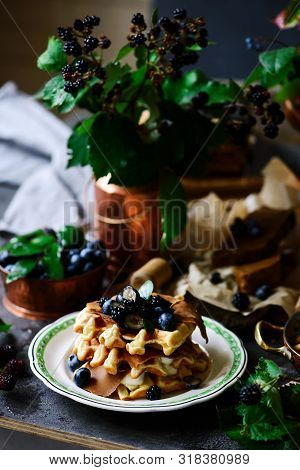 Norwegian Waffles With Brunost Cheese And Blueberries.style Rustic.selective Focus