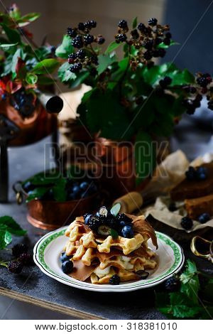 Norwegian Waffles With Brunost Cheese And Blueberries.style Rustic.selective Focus