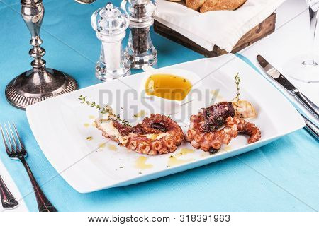 Mediterranean Dish Fried Octopus Tentacles With Bolzimik Sauce And Rosemary