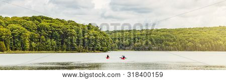 Canada Forest Park Nature With Family Friends Riding In Red Kayaks Canoe Boats In Water. Beautiful L