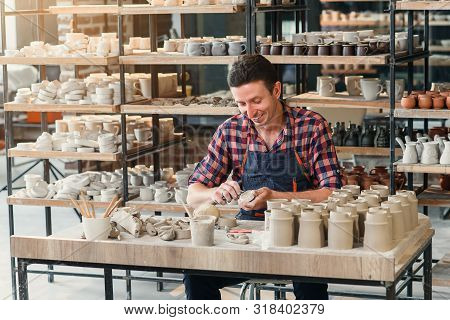 Talanted Caucasian Man Making Decoration For Cup.