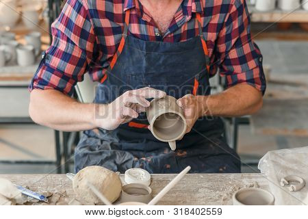 Talanted Caucasian Man Making Decoration For Cup.