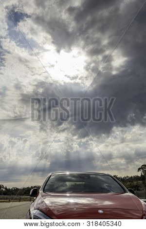 Canberra, Australia - Apr 22, 2018: Red Mercedez-benz Parked At A Public Park, With A Dramatic Sky A