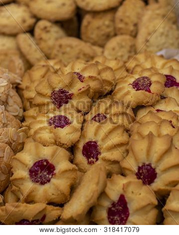 Shortbread Cookies With A Drop Of Jam, A Lot Of A Bunch Of Sweet Pastries. Curabier Dessert Vertical