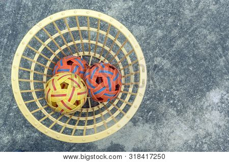 The Takraws In The Plastic Basket On The Cement Floor Beside The Field Is Used For Students To Pract
