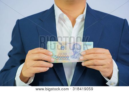 Money In Vietnam Hold On Hand Business Man Wearing A Blue Suit (socialist Republic Of Vietnam), Dong