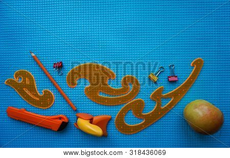 Back To School Concept. Sudent Tools On Blue Background.