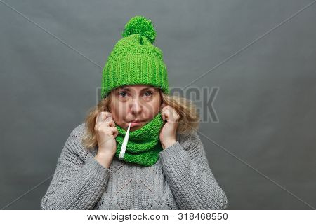 Sick Woman With Seasonal Flu Measuring Body Temperature With Thermometer In Her Mouth Reaching 38 De
