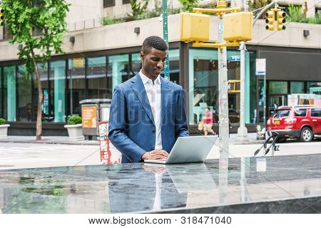 Young African American Businessman Traveling, Working In New York, Wearing Blue Suit, White Shirt, S